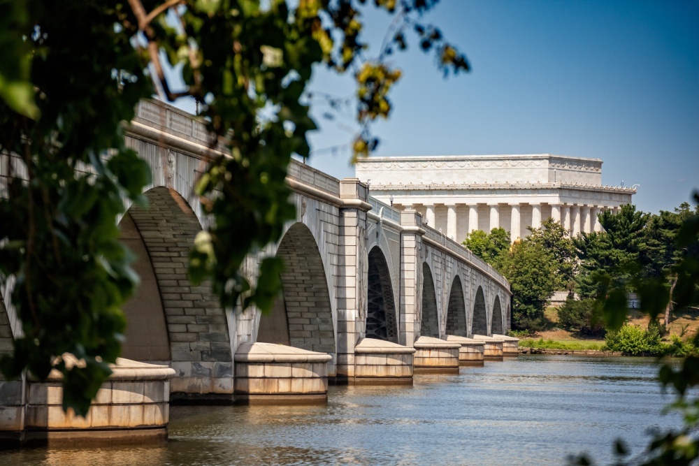 Picture of a white bridge, spanning a river. Arlington Memorial Bridge, Washington, DC.