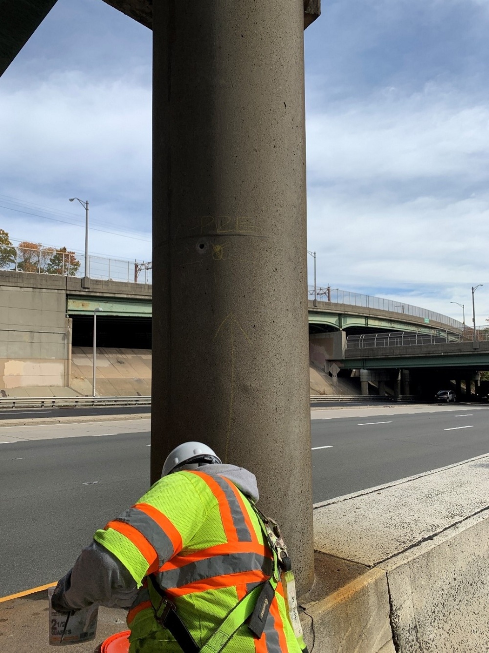 Construction personnel working on overpass pier